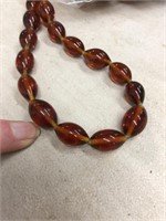 Bag of oval amber glass beads. 500 pieces
