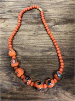 Vintage premade necklace.    Orange with swirl.
