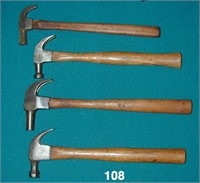 Four wooden handled claw hammers