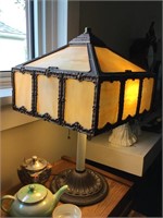 Cast base antique lamp with slag glass shade.