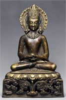 A SILVER-INLAID BRONZE AMOGHASIDDHI 13TH/14TH C