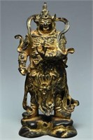 A MING GILT-LACQUERED BRONZE FIGURE OF A GUARDIAN