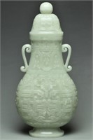 A LARGE QING WHITE JADE ARCHAISTIC VASE 18TH C