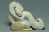 A HAN DYNASTY CALCIFIED JADE FIGURE OF A DANCER