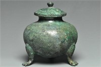A RARE TANG DYNASTY BRONZE TRIPOD JAR AND COVER