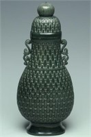 A SPINACH-GREEN JADE VASE AND COVER