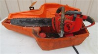 Homelite XL12 gas chainsaw with hard case.