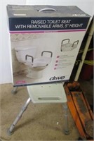 Drive raised toilet seat in original box and a