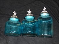 Blue glass canister set w/starfish tops