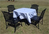 WROUGHT IRON TABLE AND 4 CHAIRS