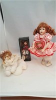 Three porcelain dolls one Precious Moments, one