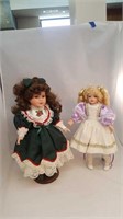 2 porcelain dolls 1 Christmas dress and bells,
