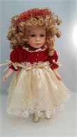 Porcelain doll red and gold dress