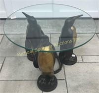 TRIPLE BRONZE PENGUIN BASE GLASS TOPPED TABLE