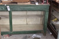 Green display case, wood top, 7'