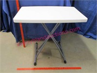 small folding table (adjustable height)