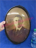 old bubble glass oval picture of a man (tin back)