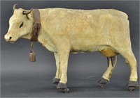 LARGE HIDE COVERED COW ON WHEELS
