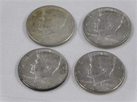 Four Kennedy silver half dollars, two 1964D -