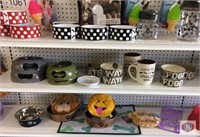 Pet feeding bowls (approx. 19). Two mugs. Emojis.