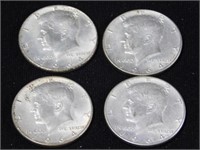 Four Kennedy silver halves, all 1964D