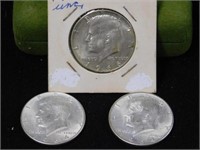 Three Kennedy silver halves, two 1964D - 1966