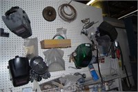 Wall of welding supplies incl. masks, wire, lights