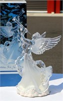 Angel Blowing Trumpet Looks Like Ice Sculpture
