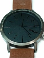 Komono Black watch with brown leather band