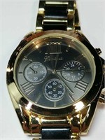 Gold colored Geneva watch
