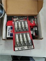 Box of new spark plugs