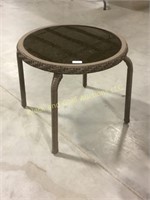 Small wicker patio table with decorated glass top