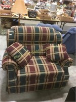 Small loveseat with a plaid style design