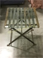 Older iron table with glass top