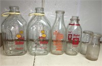 Glass milk jugs with signage