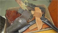 BOX OF HOLSTERS AND SCABBARDS