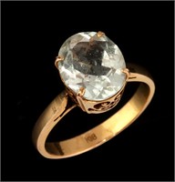 AN 18K GOLD AND NEAR COLORLESS TOURMALINE RING