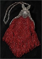 A VICTORIAN RED BEADED PURSE WITH FILIGREE FRAME