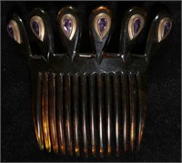 A VICTORIAN HAIR COMB WITH FACETED PURPLE STONES