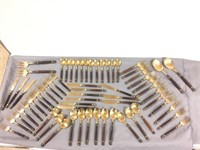 64 pieces of  Brass and Wood flatware