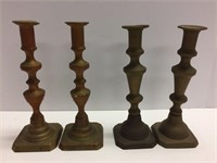 Two sets of antique brass push-up candlesticks