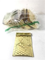 Lot of gold bubble mailers with sticky enclosures