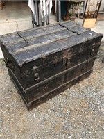Large antique immigrant trunk with metal covering
