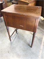 Kenmore sewing machine in mahogany cabinet
