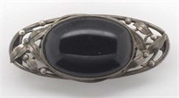Silver and onyx brooch attributed to Rhoda Wager.