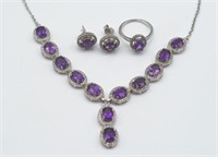 A collection of amethyst and silver jewellery
