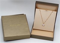 Bvlgari 18ct gold diamond pendant and chain.