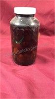 Jar of antique marbles  plastic jar