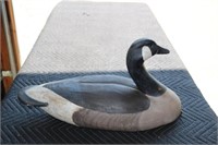 wooden goose decoy with leather strap marked ML