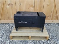 Traeger pellet stove with stove pipe